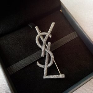YSL New Brooch 2026: Cassandre Monogram in Gold Tone with Black Enamel