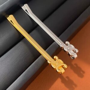 Celine's new hair clip in black, and white gold