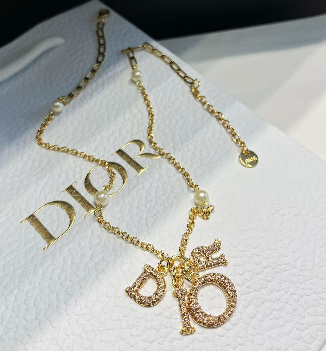 Dior Oblique Pattern Necklace: New Logo Designs 5 Dior Oblique Pattern Necklace: New Logo Designs - Image 5