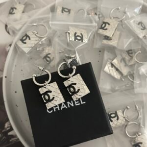 Chanel Camellia Alba Earrings: White Ceramic or Porcelain Flower Design