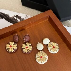 Chanel Mirrored Disc Earrings: Reflective Surface with Engraved Border