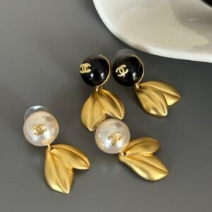 Chanel Vintage Gripoix Clip-On Earrings: Glass Cabochon & Gold Frame