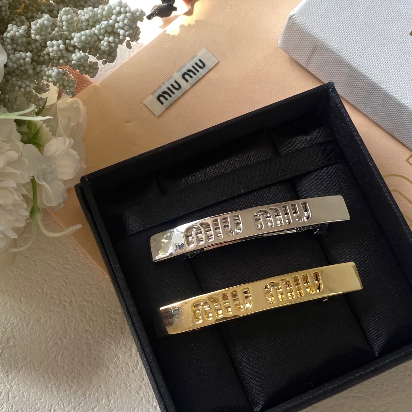 Miu Miu Double-Claw Clip: Pearlescent Finish with Hidden Logo 1 Miu Miu Double-Claw Clip: Pearlescent Finish with Hidden Logo