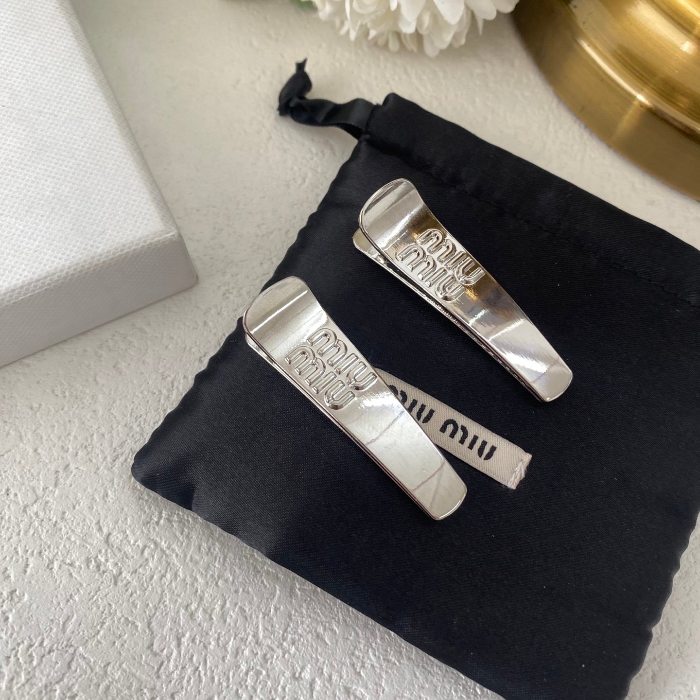 Miu Miu Matelassé Leather Hair Pin: Quilted Pattern with Mini Logo Charm 2 Miu Miu Matelassé Leather Hair Pin: Quilted Pattern with Mini Logo Charm - Image 2